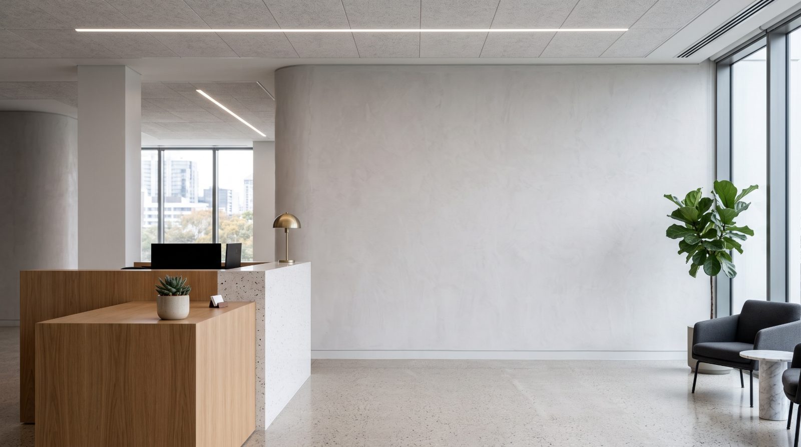 Modern office lobby with wooden reception desk, white walls, and floor-to-ceiling windows overlooking city skyline